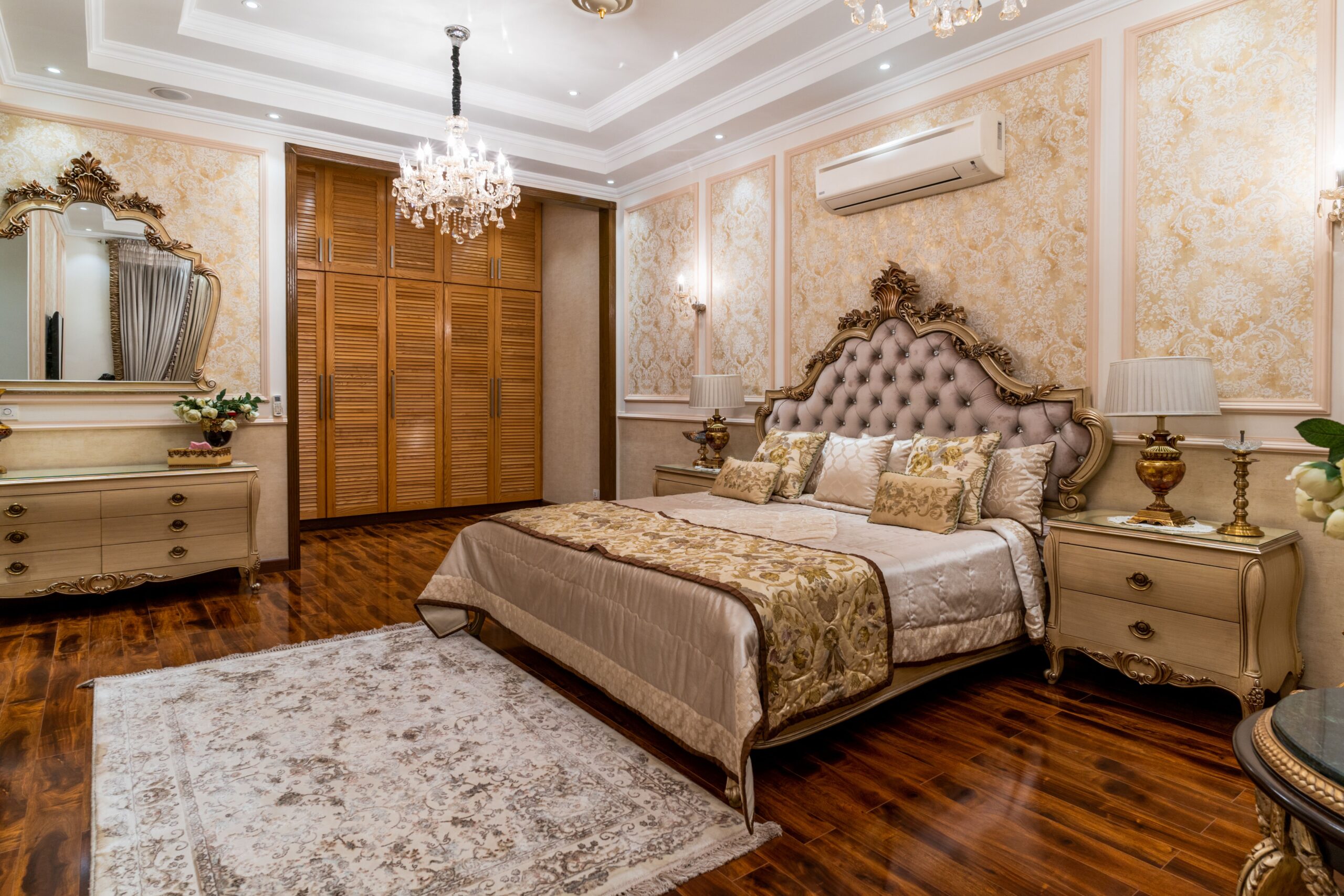 Elegant interior of a luxury bedroom with chandeliers and classic furniture, exuding opulence and style.
